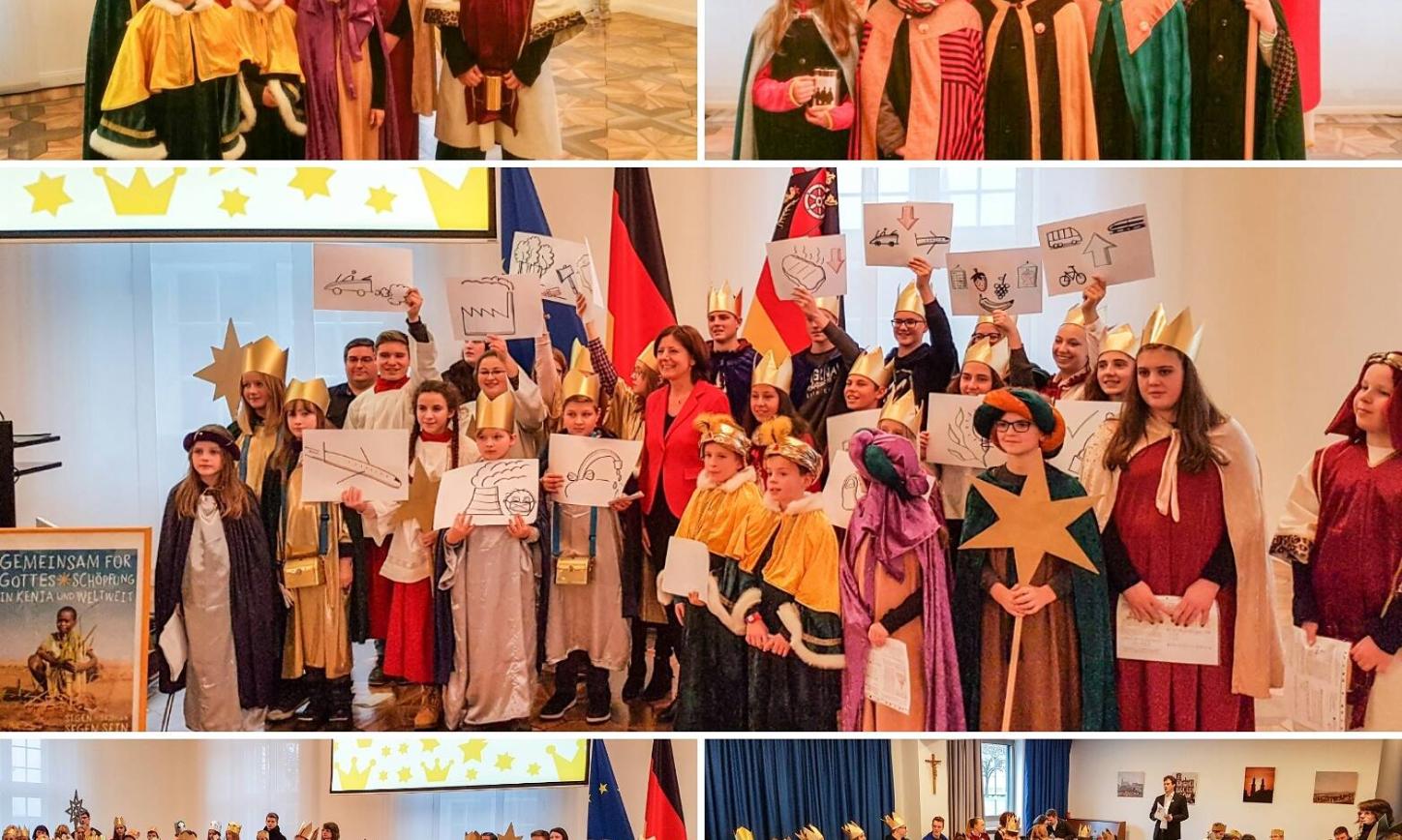 Das Bild zeigt Sternsinger bei Malu Dreyer