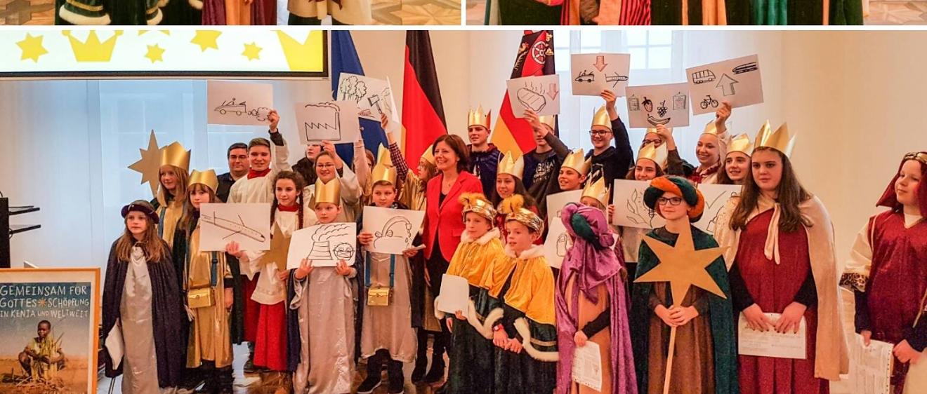 Das Bild zeigt Sternsinger bei Malu Dreyer